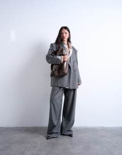 Model wearing Tatum whipstitch tote bag in chocolate