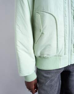 Model wearing Techy bomber jacket in sage