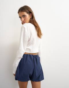 Model wearing Techy bubble hem shorts in navy