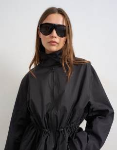 Model wearing Techy drawcord waist jacket in black