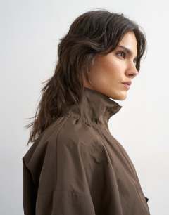 Model wearing Techy drawcord waist jacket in brown