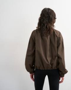 Model wearing Techy drawcord waist jacket in brown