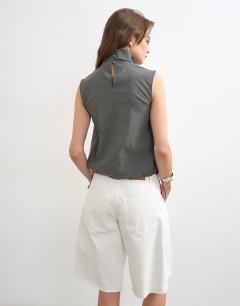 Model wearing Techy funnel drawstring hem top in slate