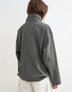 Model wearing Techy funnel neck jersey track top in slate - CHARCOAL