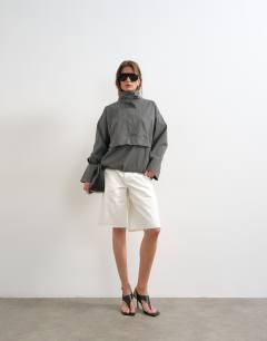 Model wearing Techy funnel neck track top in slate