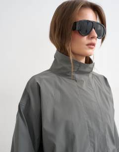 Model wearing Techy funnel neck track top in slate