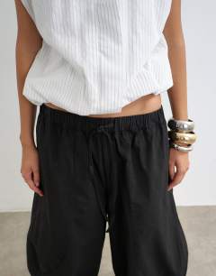 Model wearing Techy horseshoe trouser in black