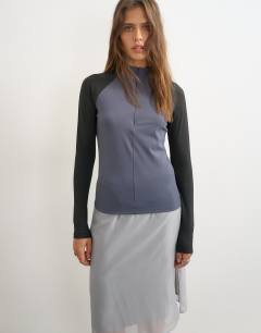 Model wearing Techy long sleeve quarter zip top in navy