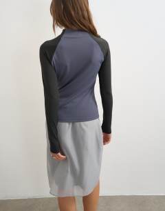Model wearing Techy long sleeve quarter zip top in navy