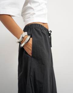 Model wearing Techy oversized ovoid mid length trouser in black