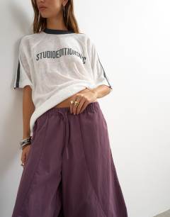Model wearing Techy oversized ovoid mid length trouser in fig