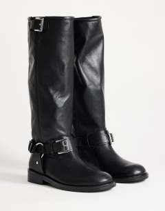 Model wearing Tee premium leather knee high riding boot in black
