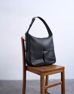 Model wearing Teegan premium real leather oversize weave tote in black