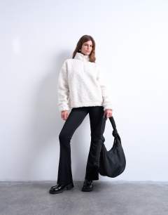 Model wearing Terry nylon shoulder zip pocket bag in black