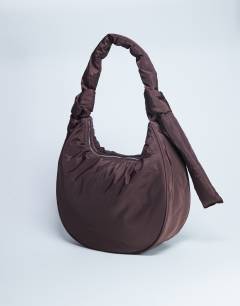 Model wearing Terry nylon shoulder zip pocket bag in chocolate