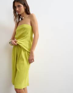 Model wearing Textured board short co-ord in green
