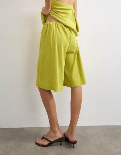 Model wearing Textured board short co-ord in green