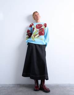 Model wearing Textured knitted tulip jumper in blue
