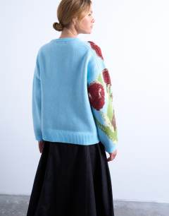 Model wearing Textured knitted tulip jumper in blue