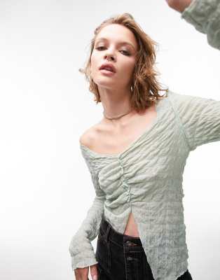 textured long sleeve v neck top in green-White