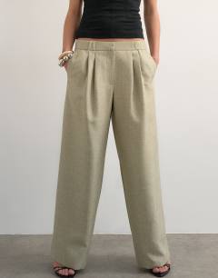 Model wearing Textured plain elasticated tailored trouser in stone