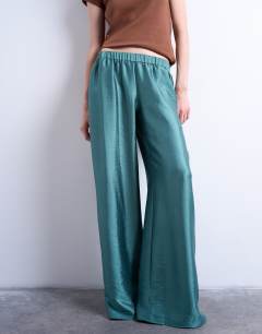 Model wearing Textured satin low rise straight leg drawcord trouser in turquoise