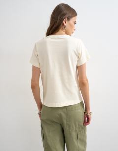 Model wearing The point of it all graphic tee in buttermilk