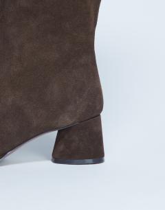 Model wearing Thea real suede knee high block heel boot in chocolate