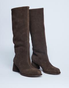 Model wearing Thea real suede knee high block heel boot in chocolate