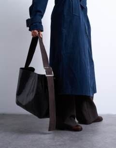 Model wearing Tiana premium real leather tote bag with buckle in black and brown
