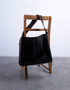 Model wearing Tiana premium real leather tote bag with buckle in black and brown