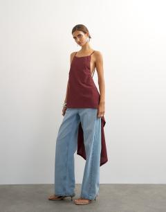 Model wearing Tie back drape detail top in plum