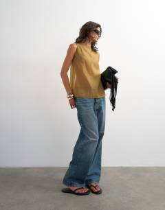 Model wearing Tie back sleeveless organza top in khaki
