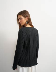 Model wearing Tie detail blouse in black