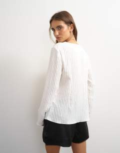 Model wearing Tie detail blouse in ecru