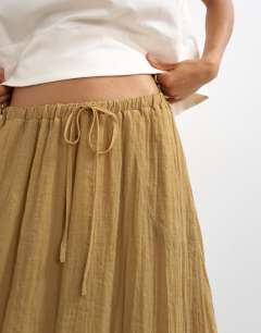 Model wearing Tie detail crinkle bubble hem maxi skirt in camel