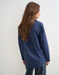 Model wearing Tie detail shirt in navy