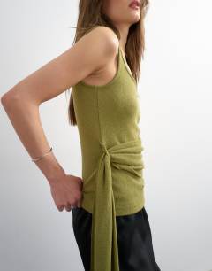 Model wearing Tie drape waist detail vest in olive green