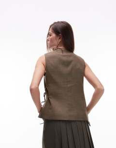 Model wearing Tie side waistcoat in khaki