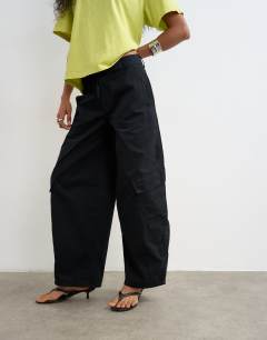 Model wearing Tie waist cargo trouser in black