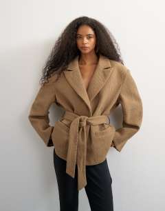 Model wearing Tie waist chevron blazer coat in tan
