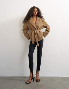 Model wearing Tie waist chevron blazer coat in tan