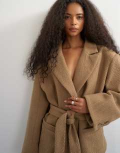 Model wearing Tie waist chevron blazer coat in tan
