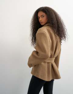 Model wearing Tie waist chevron blazer coat in tan