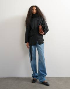 Model wearing Tie waist funnel neck tunic top in black