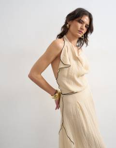 Model wearing Tie waist halter neck maxi dress with contrast trim in ecru