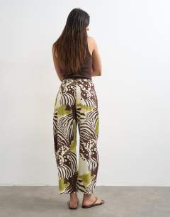 Model wearing Tie waist horseshoe trouser in abstract zebra