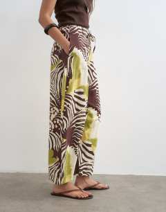 Model wearing Tie waist horseshoe trouser in abstract zebra