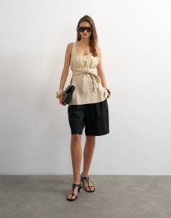 Model wearing Tie waist scoop cami in stone