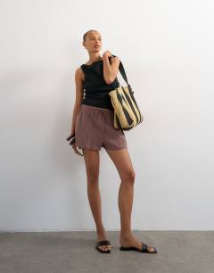 Model wearing Tie waist seam detail shorts in chocolate
